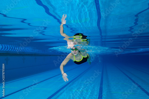 Underwater Photo of Young Female Athlete Swimming in Pool.