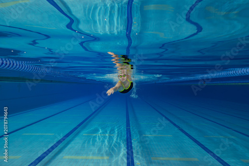 Underwater Photo of Young Female Athlete Swimming in Pool.