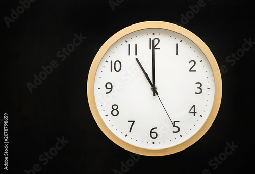 wall clock showing 11 o'clock. 23:00