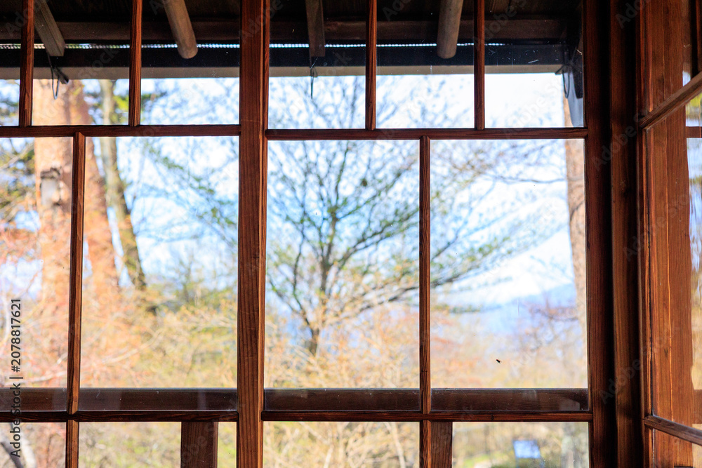 Fototapeta premium Early Spring View Through a Window of Former Hawaiian Kingdom Diplomatic Residence in Ikaho, Japan