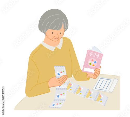 処方薬（一包化）をお薬手帳で確認するシニア女性