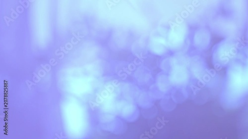 Abstract purple background with bokeh bright shiny light shadow motion movement for creative cosmetic or holiday festival design