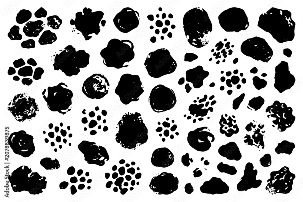 Fototapeta premium Abstract black ink blots and splatter patterns on white background.