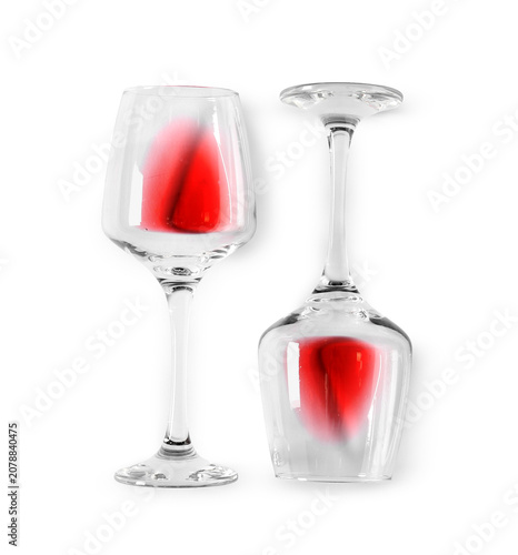 Glasses of red wine on whit...