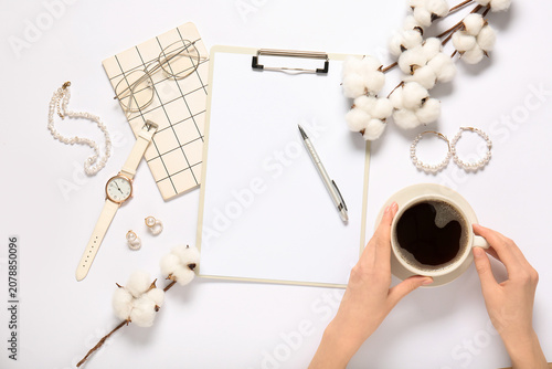 Female hands with clipboard...