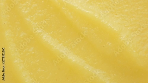Macro texture of smooth organic apple puree top view.