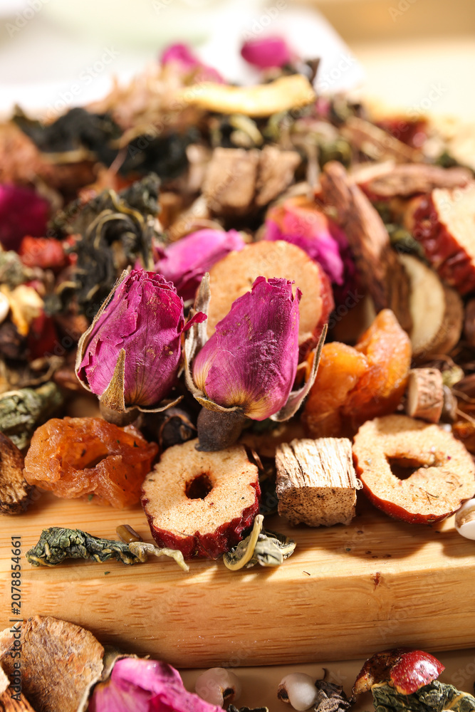 Fototapeta premium Traditional Chinese Herbal Tea Ingredients with Rose Buds and Dried Fruits for Health Enhancement