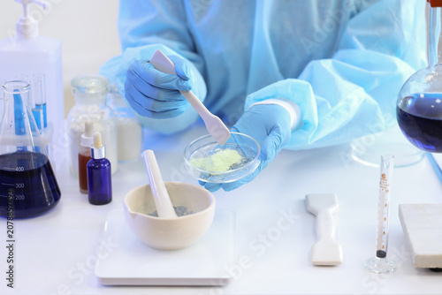 Young female chemist with m...
