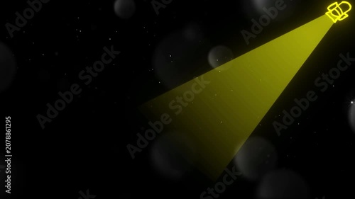 Spotlight shines a yellow beam of light into a dark environment populated by soft floating spheres.