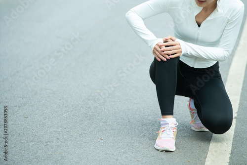 Tableau sur toile Cropped shot Woman Runner Suffering Knee Pain Injury During Outdoor Workout in P