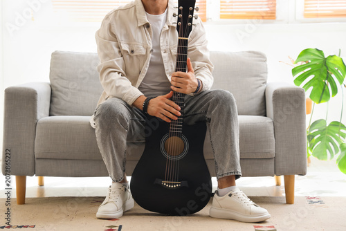 Young man with acoustic gui...