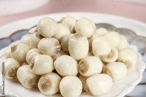 Fresh Lotus Seeds on White Plate - Healthy Asian Superfood Ingredient Studio Shot