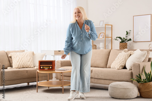 Senior woman with retro rad...