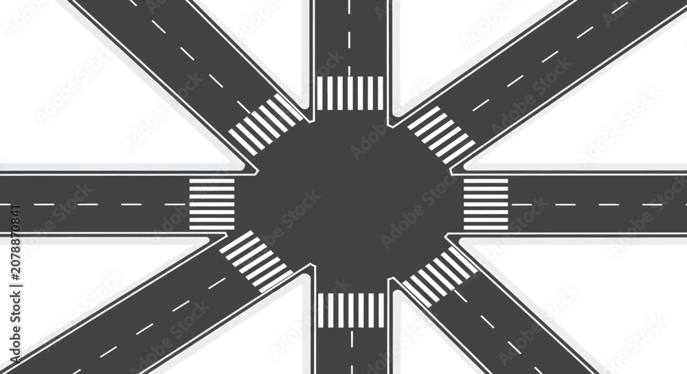Fototapeta premium A top-down view of a complex multi-directional road intersection with multiple zebra crossings.