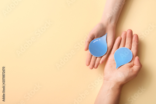 Female hands with paper wat...