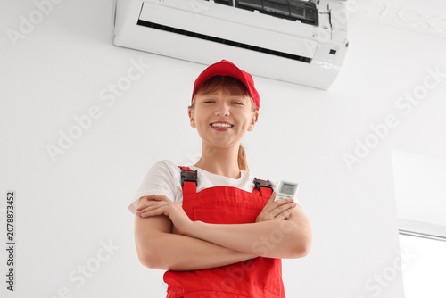 Female technician near air ...