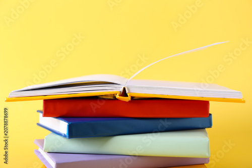 Many colorful books on yell...