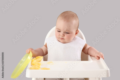 Cute little baby with food ...