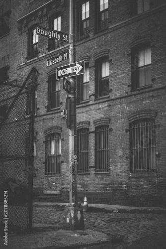 street corner with various elements such as a fire hydrant, a pole with...