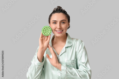 Happy young woman with hair...