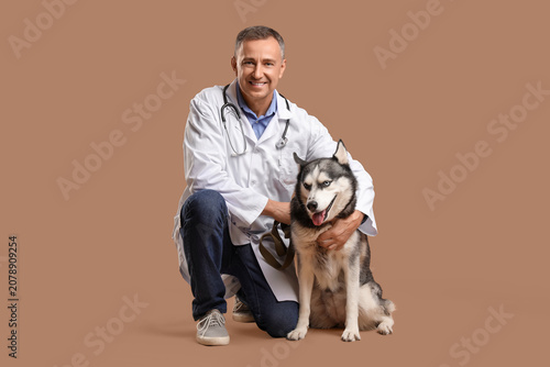 Male veterinarian with cute...