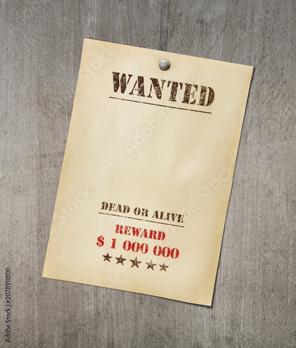 wanted poster on wooden sufrace