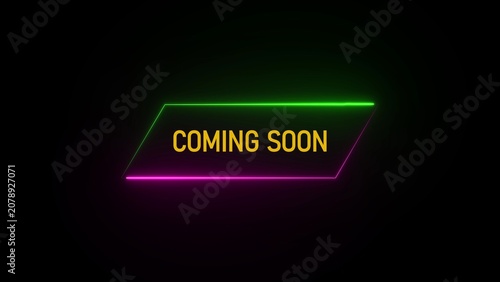 Neon glowing text COMINGSON inside a geometric shape with green and pink lights on a black background