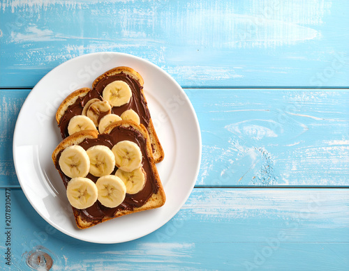 Delicious Banana and Chocolate Spread Toast on a White Plate.