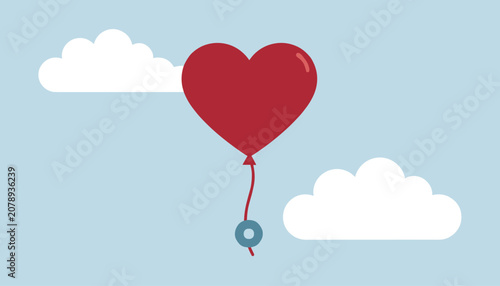 Cute red heart-shaped balloon floats in a pale blue sky between two white fluffy clouds, anchored by a small weight.