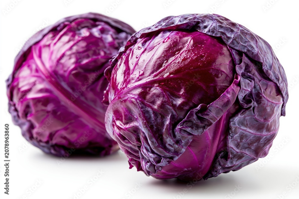 Obraz premium Vibrant Pair of Fresh Red Cabbages Isolated on White Background, Healthy Food Ingredient