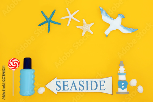 Schilderij op canvas Fun at the seaside summer holiday symbols with sign, suntan lotion, shells, lighthouse, lollipop and seagull on yellow background