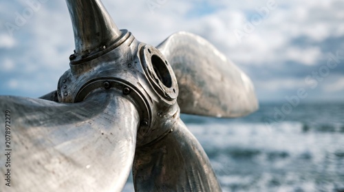Close Up Mechanical Detail of Large Metal Ship Propeller in Dock