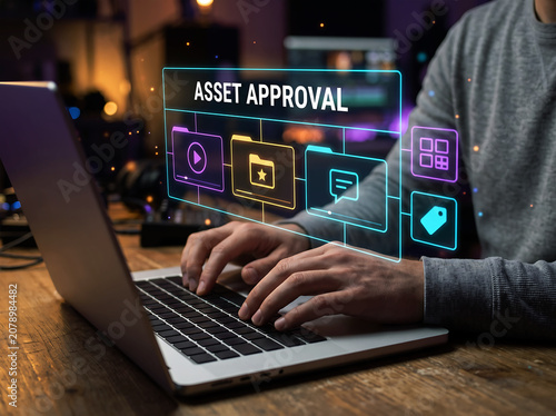 Asset approval concept with video, folder, and document icons on a laptop screen with person typing in creative studio background.