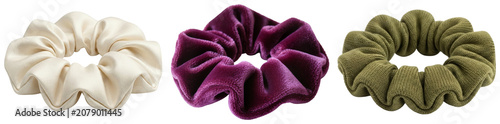 Tableau sur toile Three scrunchies: cream satin, purple velvet, and olive green knit, isolated on