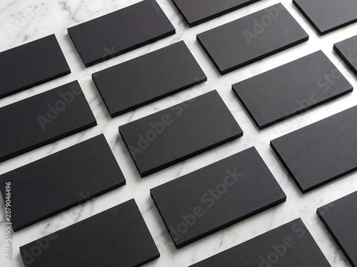 Premium blank black business card mockup grid on white marble background