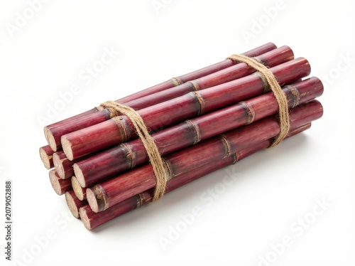 Red Sugarcane Stems Tied Together on White Background