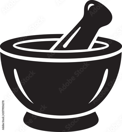 A large mortar and pestle sits on a table indoors.
