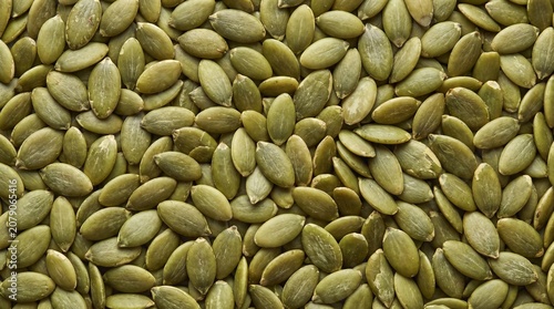Foto Abundant collection of vibrant green pumpkin seeds viewed from directly above fi