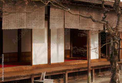 Traditional Japanese house exterior with wooden veranda paper shoji sliding doors and bamboo blinds