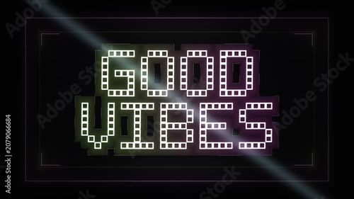 Bright neon sign showcasing good vibes in a dark setting