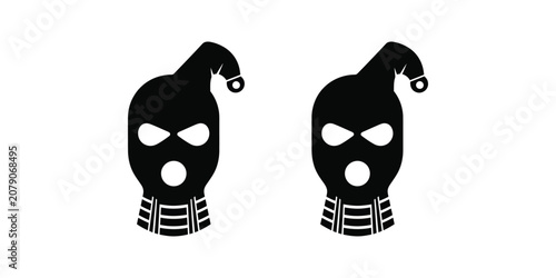 Billede på lærred Two black balaclava ski masks with Santa Claus hats isolated on white background