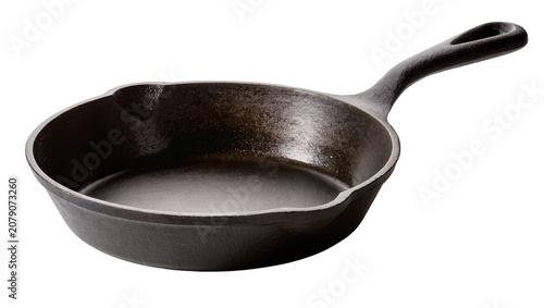 Tableau sur toile Isolated dark seasoned cast iron skillet, a traditional heavy-duty kitchen cooki
