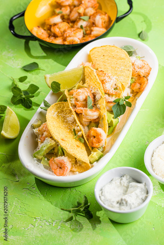 Mexican tacos with shrimp, fresh vegetables and lime