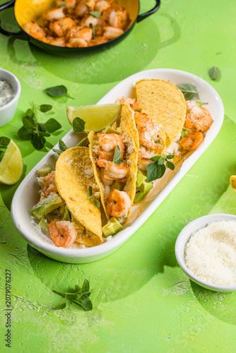 Mexican tacos with shrimp, fresh vegetables and lime