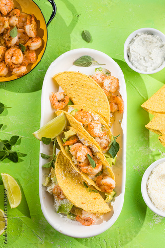Mexican tacos with shrimp, fresh vegetables and lime