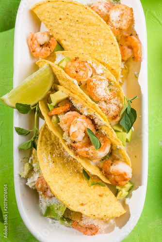 Mexican tacos with shrimp, fresh vegetables and lime