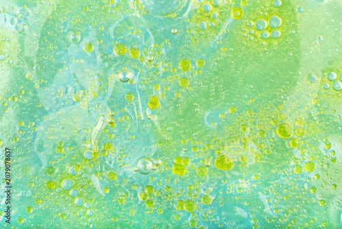 Water background with oil stains. Water background with vibrant oil stains and bubbles, showcasing mix of colors, creating visually striking and textured surface