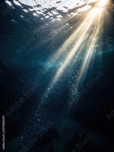 Sunlight filtering through ocean water surface