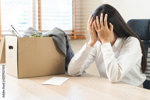 Konstfotografi Unemployed, quite job, desperate asian young businesswoman resigning from company packing belongings, stuff in box cardboard, layoff or leaving, changing work