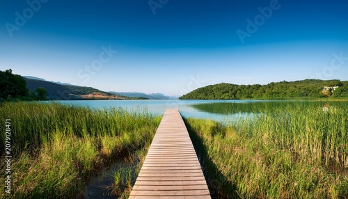 a wooden path to calm lake landscape nature photo minimal wallpaper